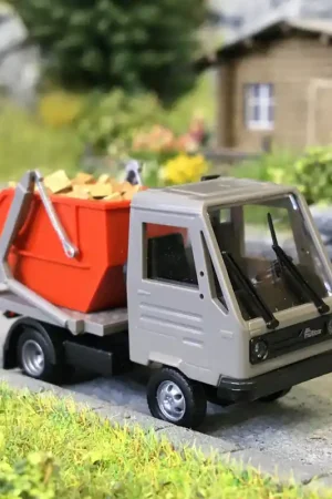 Commande En Gros Multicar M26, avec chargeur à benne et grumes - BUSCH 42237- HO 1/87